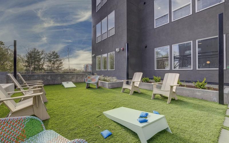 a backyard with chairs and tables