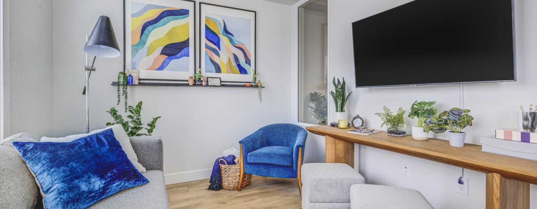 a living room with a tv and couches