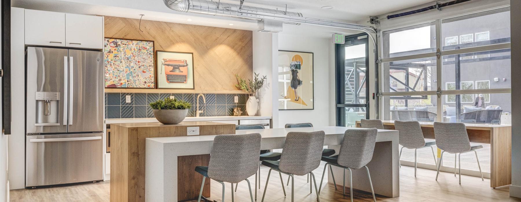 a kitchen with a dining table and chairs