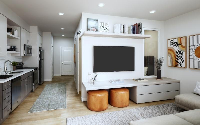 a kitchen with a tv and a couch